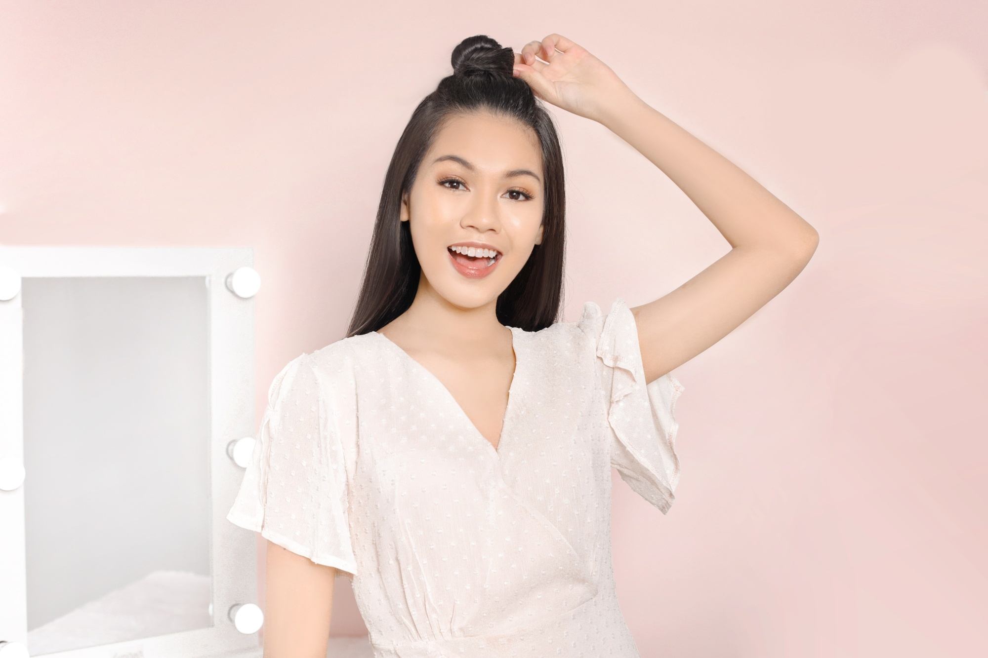 Asian woman with a half up top know hairstyle for long hair