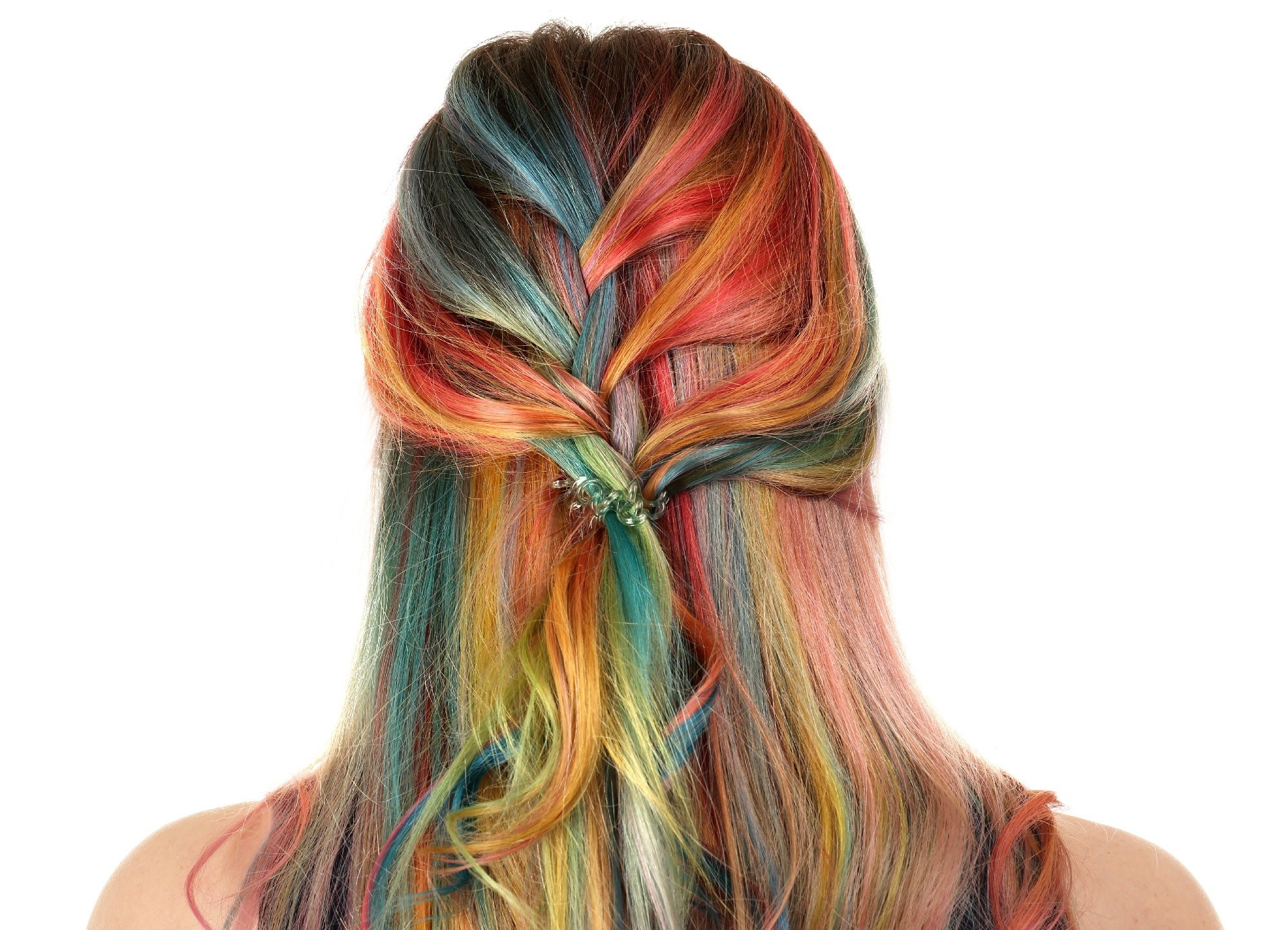 Back of a woman with long rainbow hair in braids