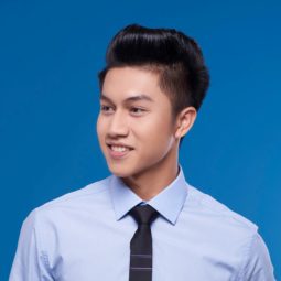 Pinoy haircut: Asian man with short black pompadour hair smiling