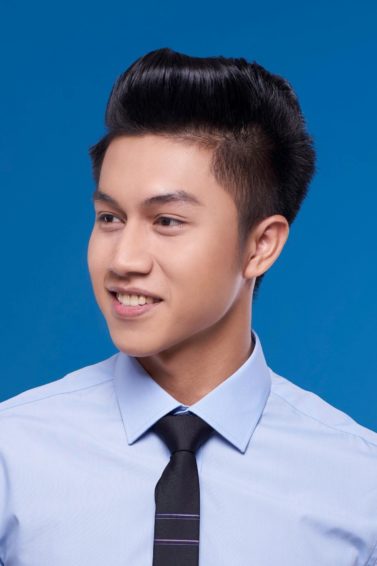 Pinoy haircut: Asian man with short black pompadour hair smiling