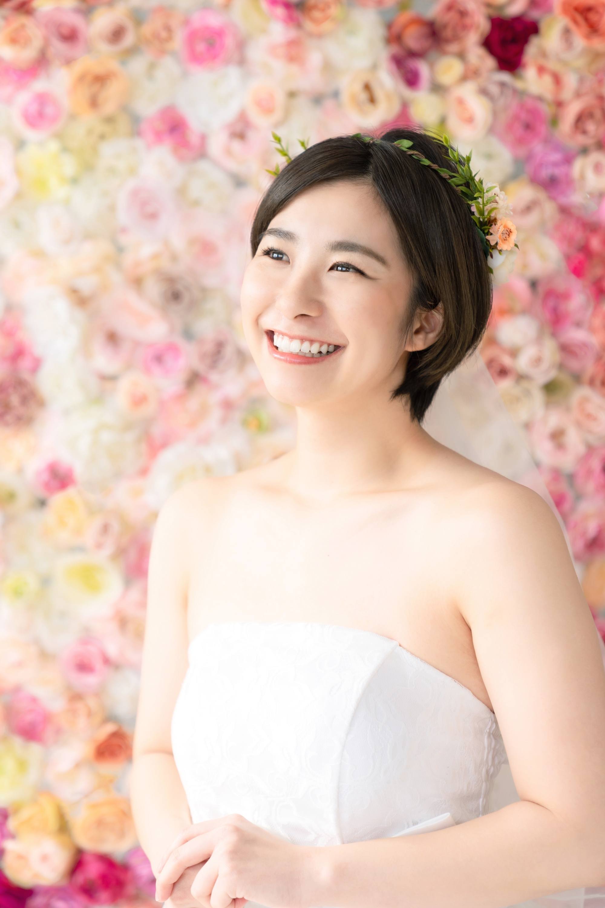 Asian woman with a flower crown for her wedding hairstyle for short hair