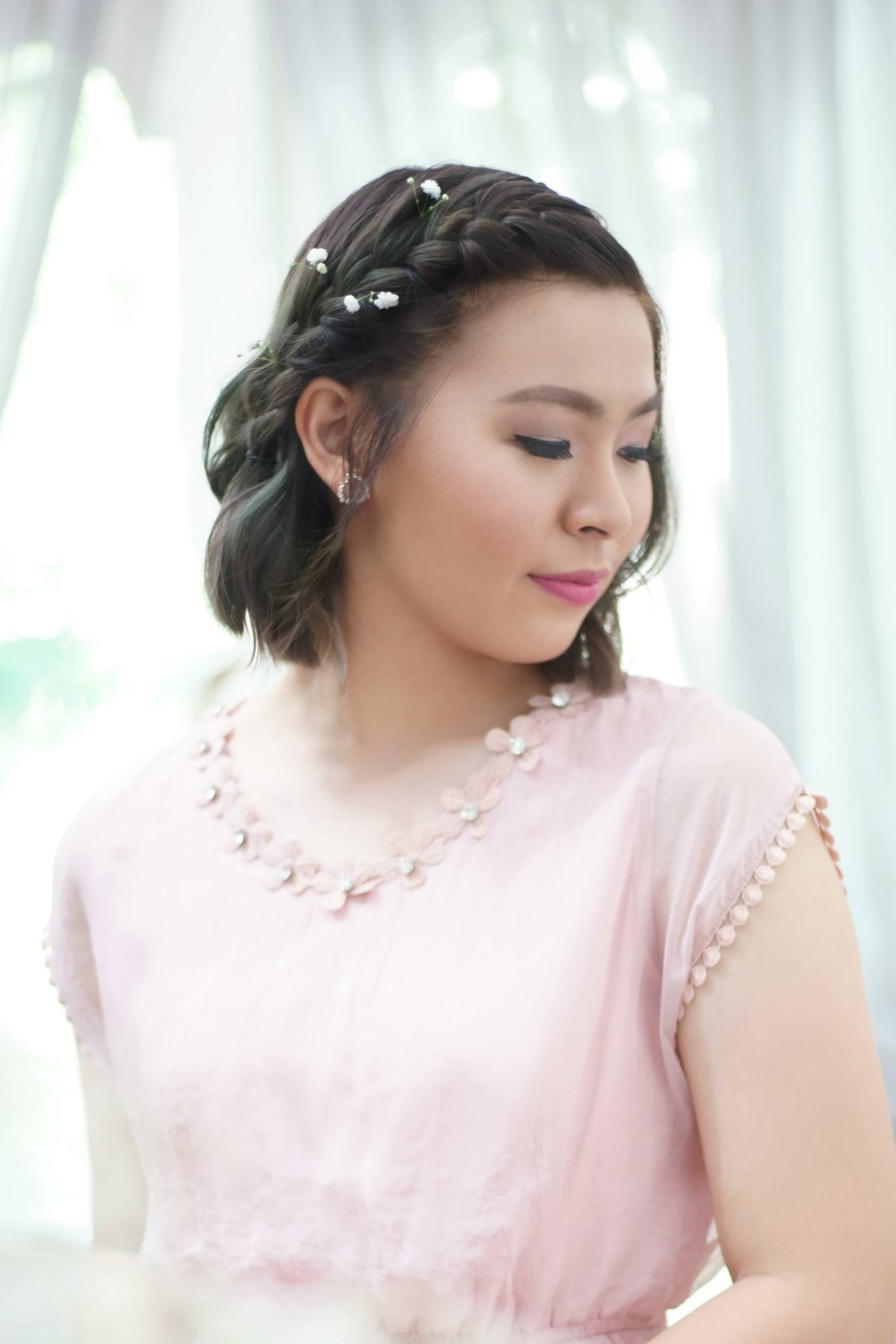 Asian woman with a braid for short hair