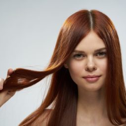 Woman with long straight cinnamon hair