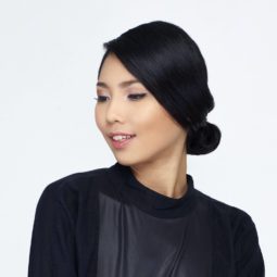 Elegant updos: Asian woman with black hair in chignon