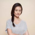 Side hairstyles: Asian woman with side fishtail braid