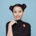 Advent calendar: Closeup shot of Asian girl with black hair in space buns wearing a black shirt