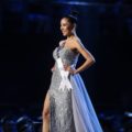 Miss Universe 2018 hairstyles: Miss Myanmar Hnin Thway Yu Aung with black hair in ballerina bun wearing a silver gown on stage