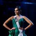 Miss Universe 2018 hairstyles: Miss Malta Francesca Mifsud with black hair in chignon wearing a green evening gown on stage