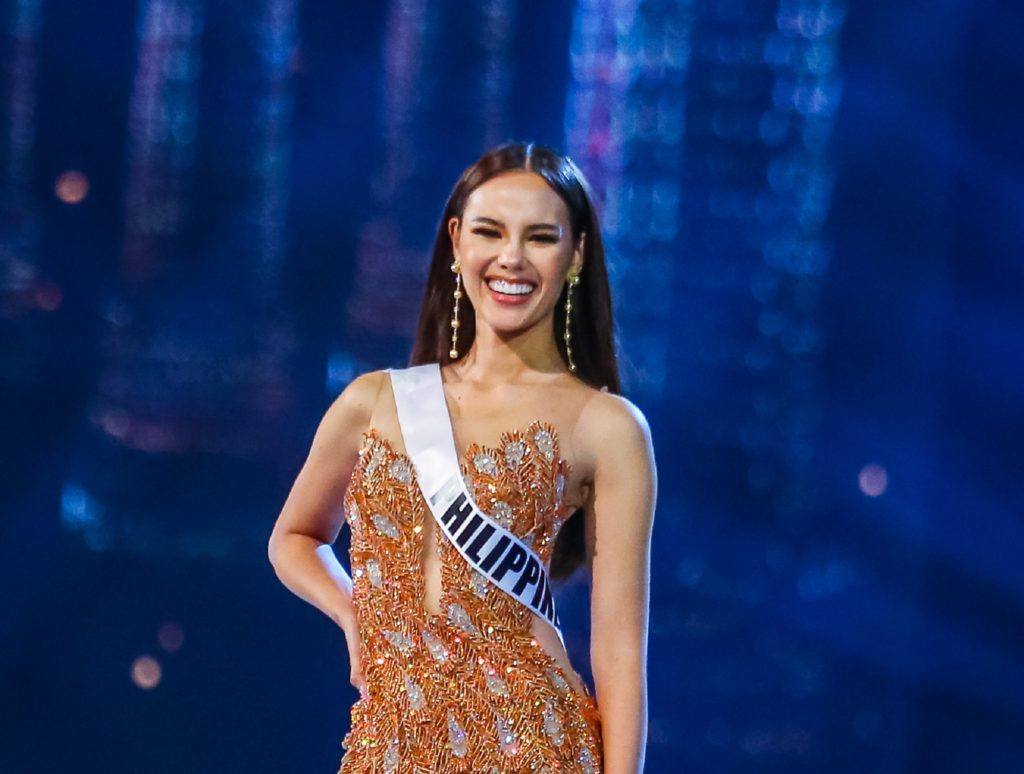 Miss Universe 2018 Miss Philippines Catriona Gray with long straight black hair wearing an evening gown on stage
