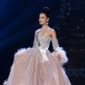 Miss Universe 2018 hairstyles : Ms. Kyrgyzstan Begimay Karybekova with black hair in a bun and light pink ball gown on stage