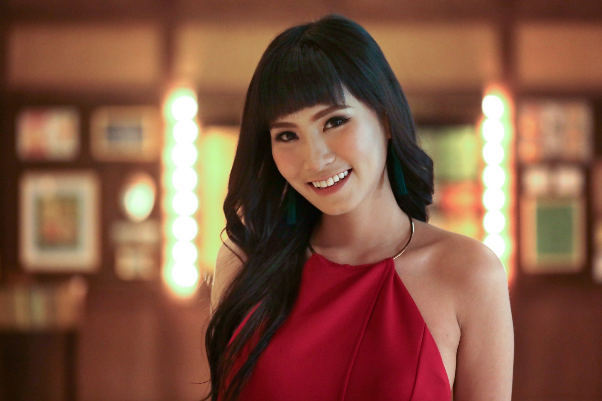 New Year's Eve Hairstyles: Asian woman with long black hair and baby bangs