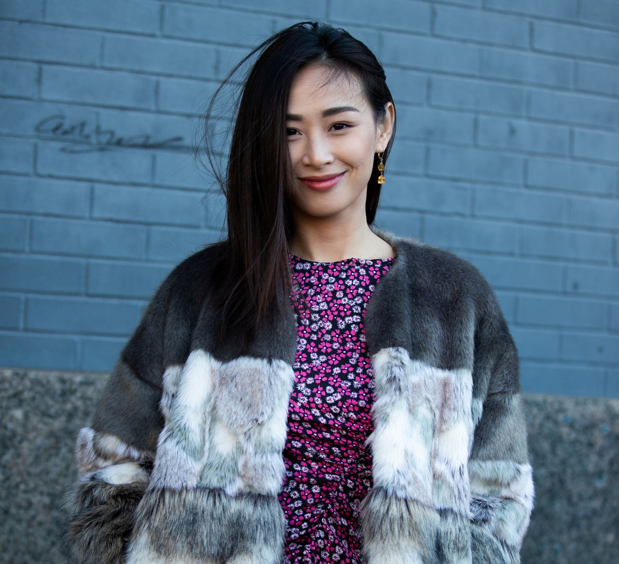 Street style hair inspiration: Asian woman with long straight black hair wearing a coat outdoors