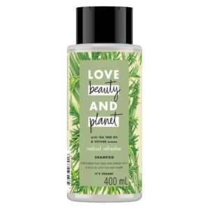 Bottle of Love Beauty and Planet green shampoo