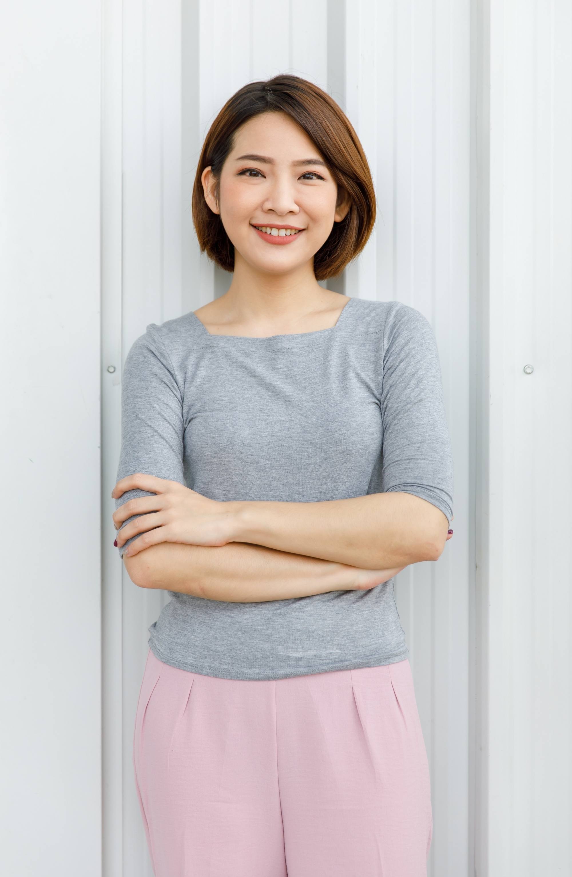 Asian woman with short caramel brown hair color