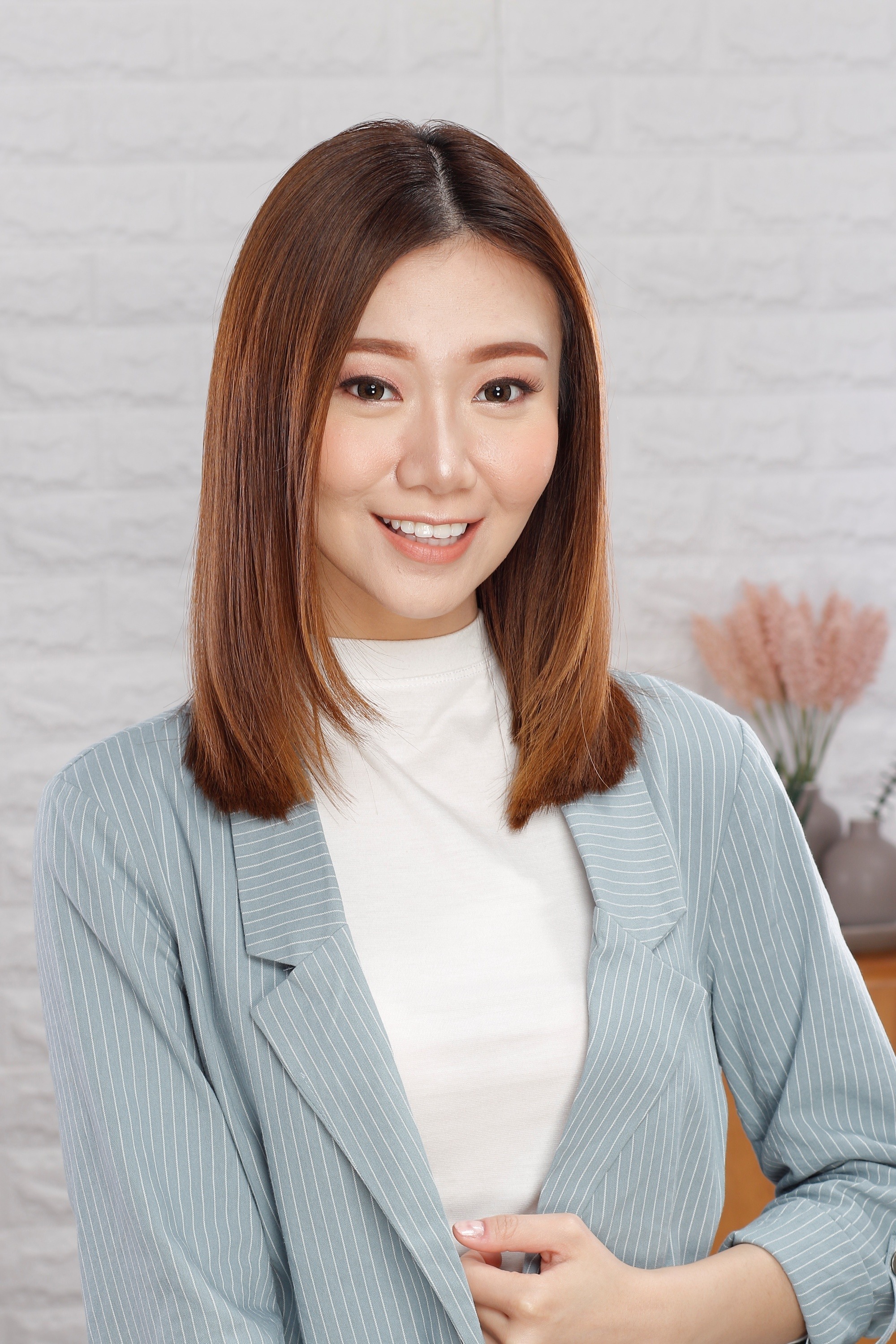 Asian woman with caramel brown hair color