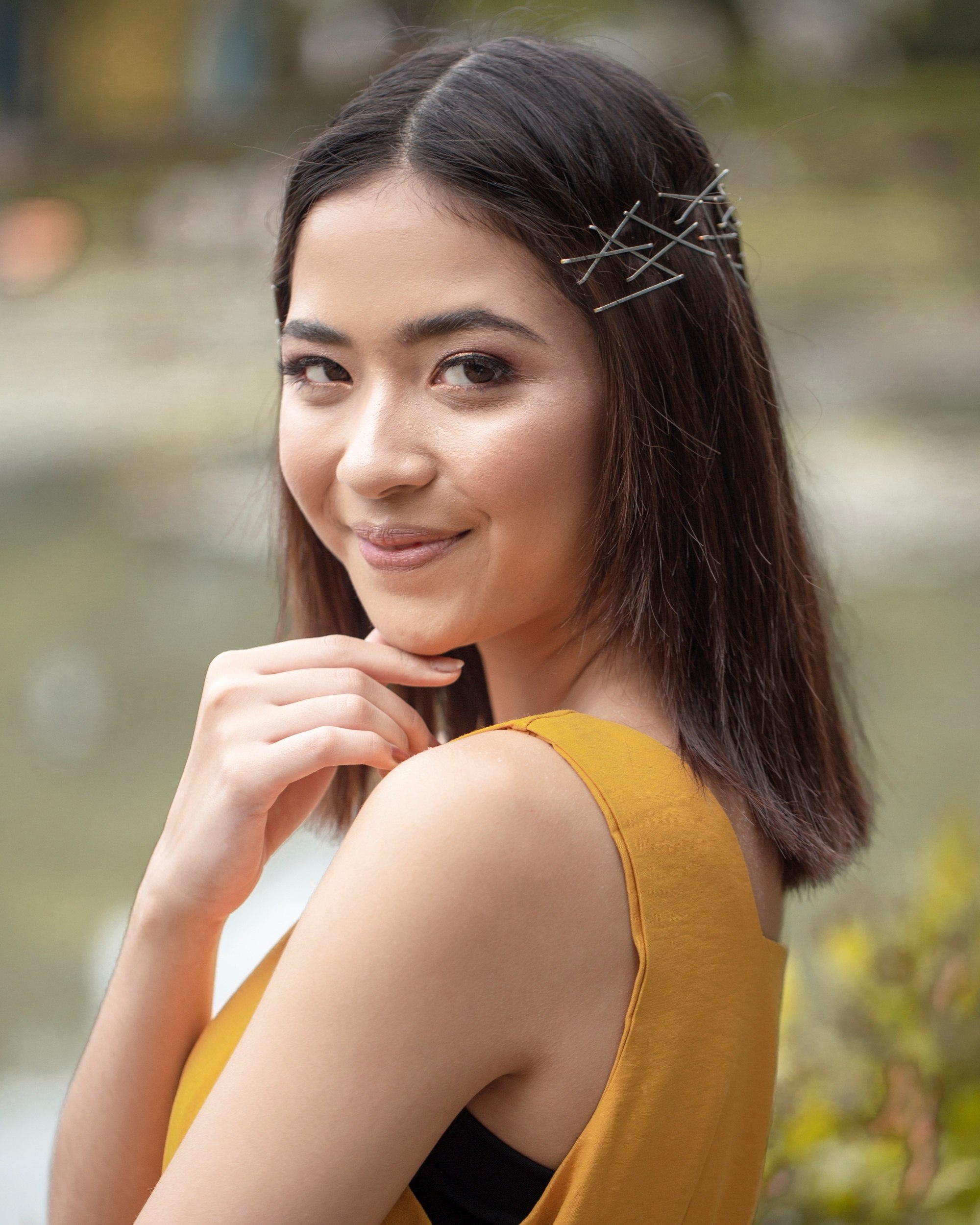 Bobby pin hair crown: Asian woman with bobby pin hair crown smiling