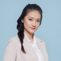 Rectangle Face: Asian woman with long hair in a braid wearing an office attire