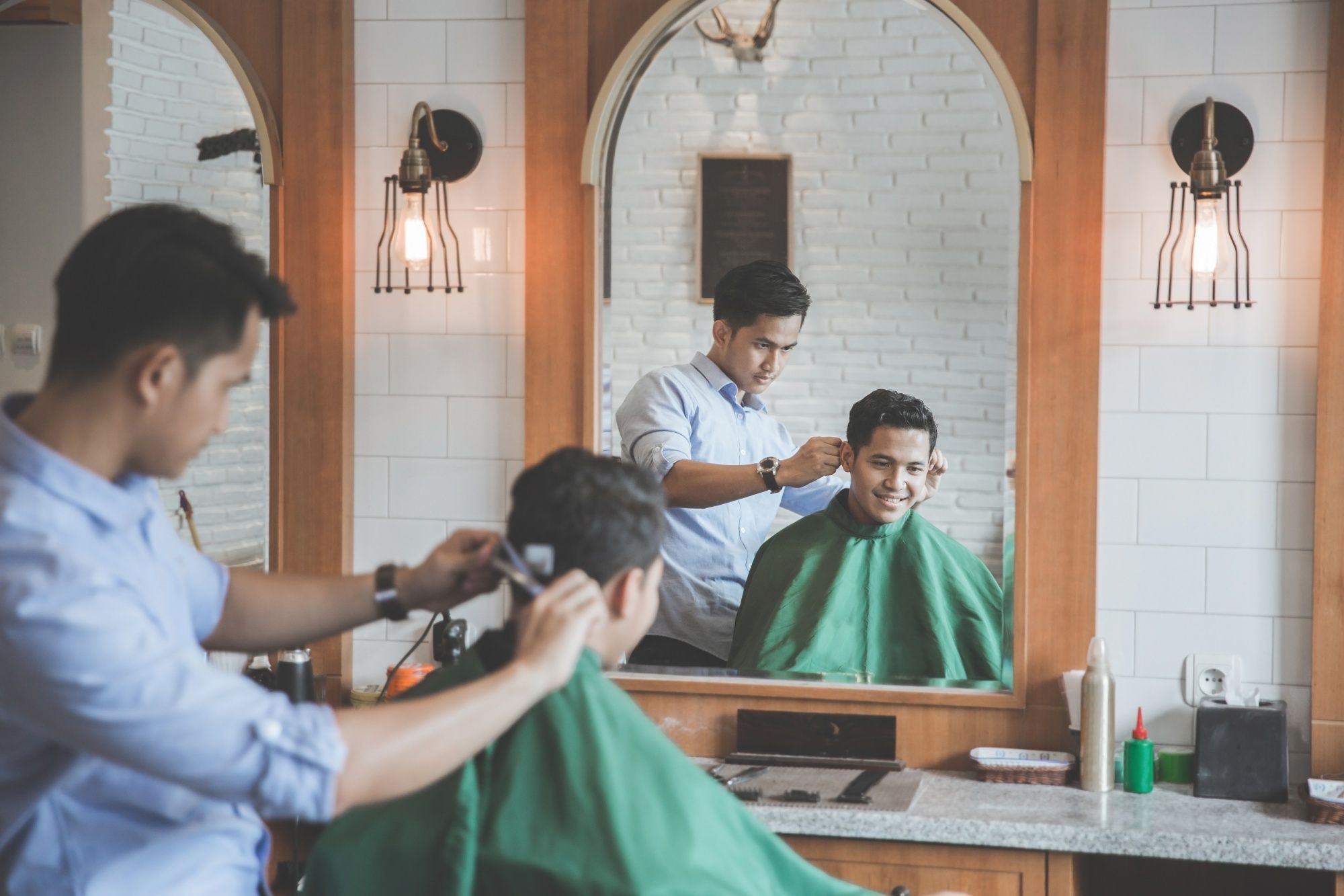 Men's grooming: Man getting a haircut in a barber shop
