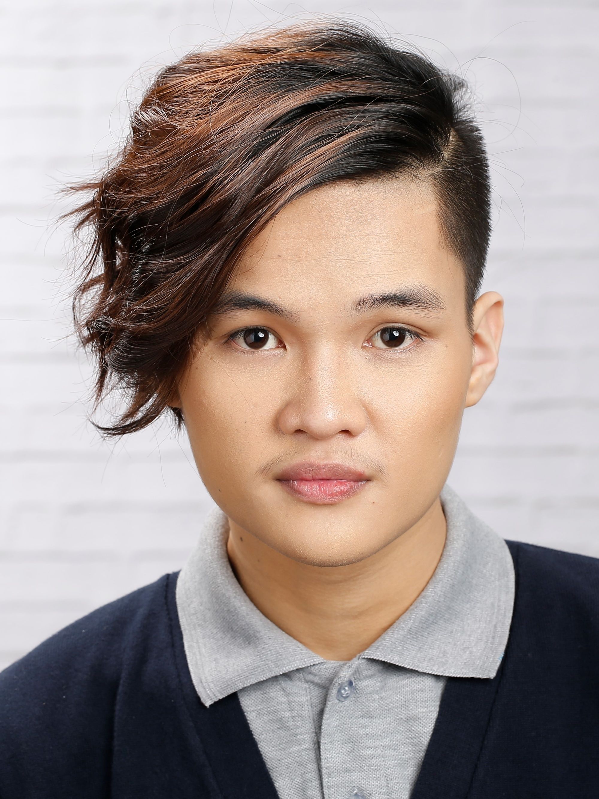 Asian man with a messy hairstyle