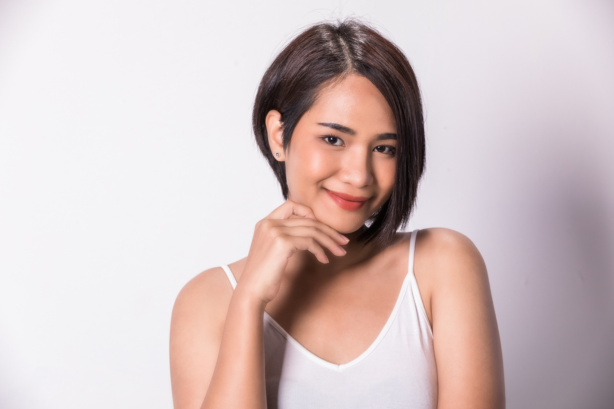 Asian woman with an asymmetrical short haircut