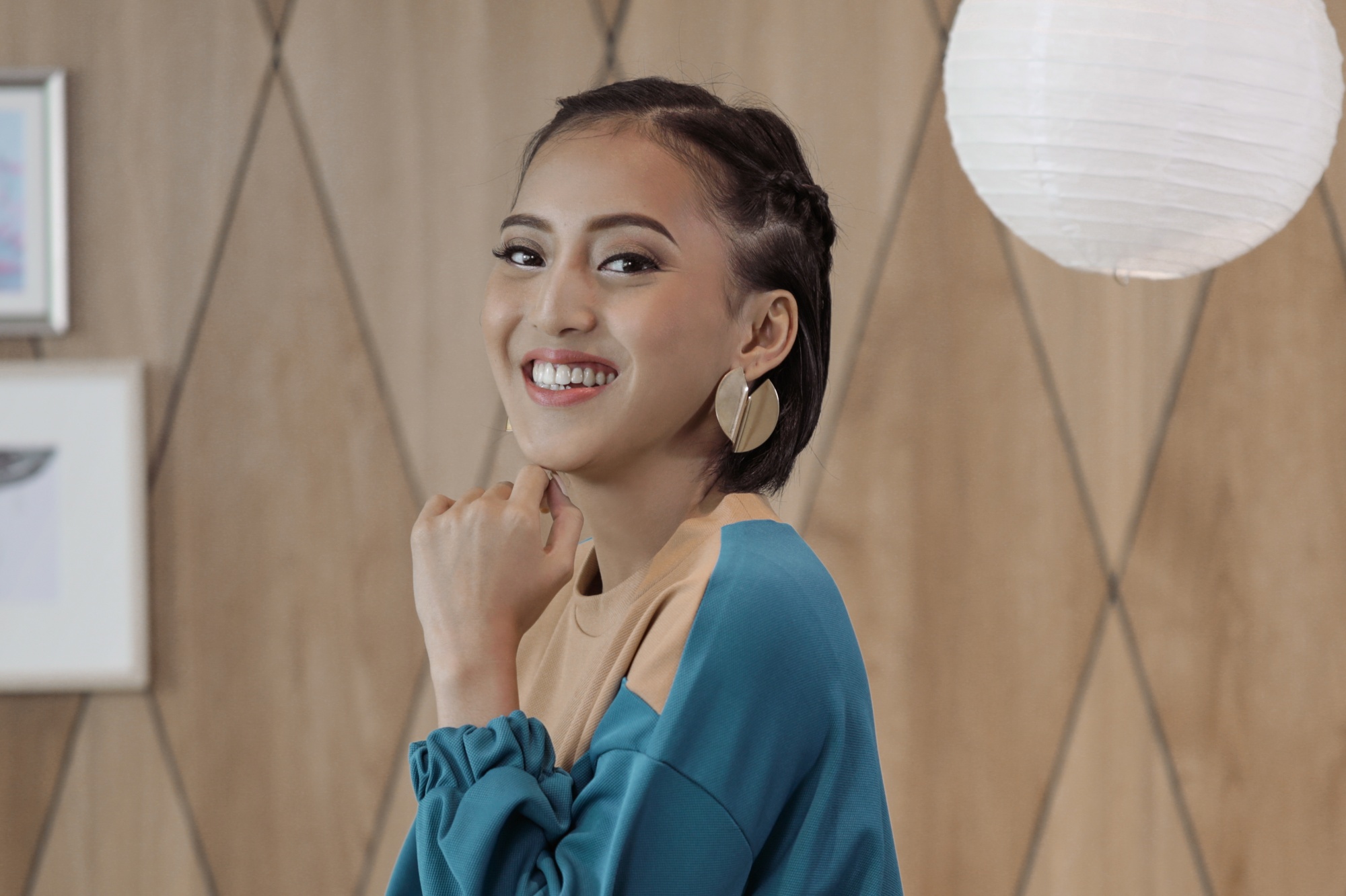 Asian woman with braids on her short hair
