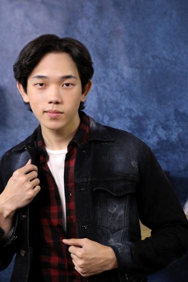 Asian man with Korean wavy hairstyle for men wearing a black leather jacket