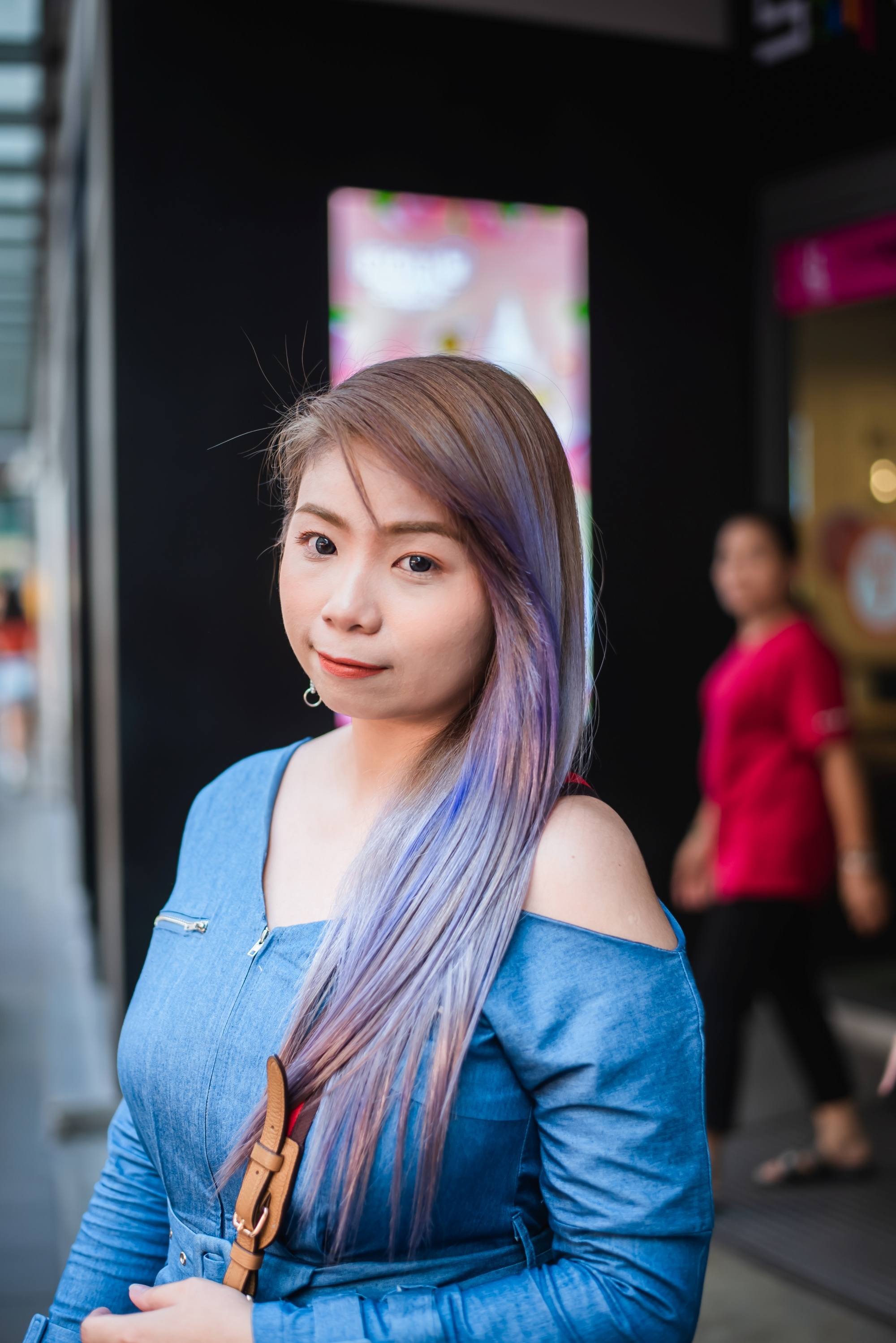 Asian woman with long blue and purple hair