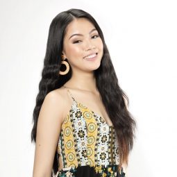 Asian woman with long mermaid waves smiling