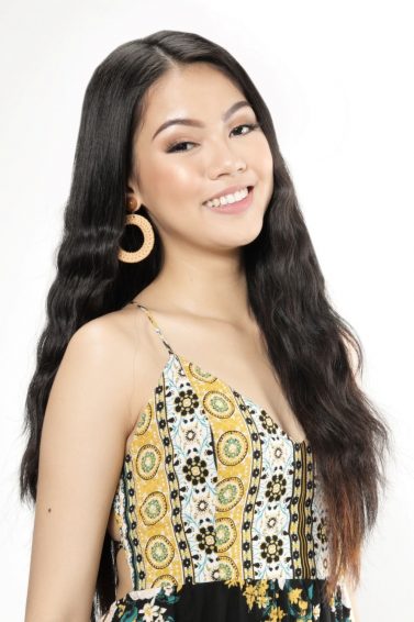 Asian woman with long mermaid waves smiling