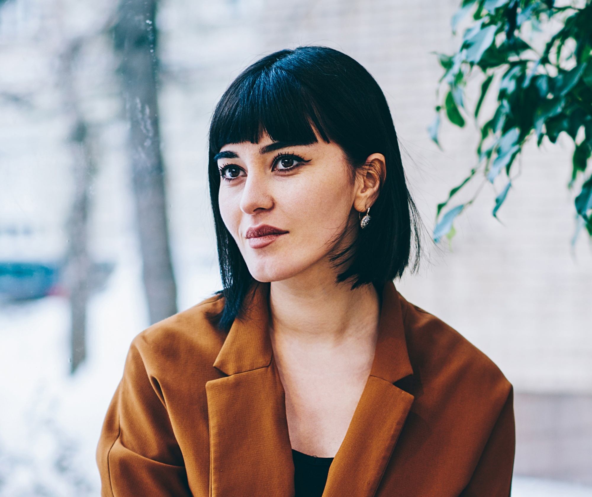 Woman with black square haircut with bangs
