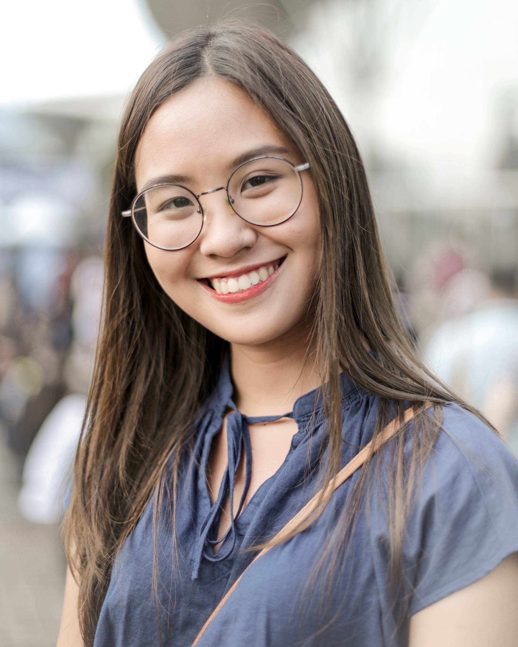 Breakup hair makeover ideas: Asian woman with long ash brown hair smiling