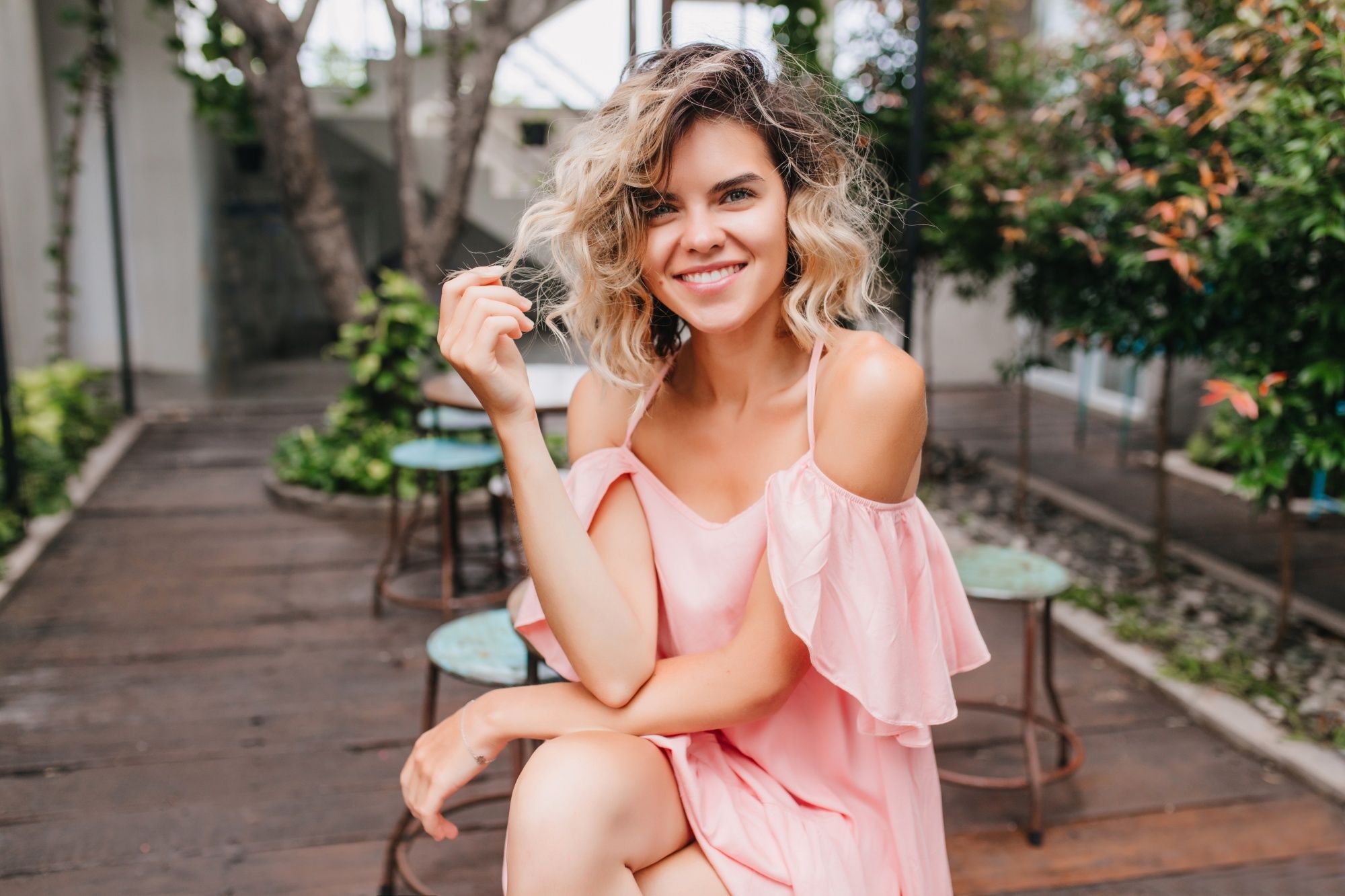 Short wavy hair ideas: Woman with short wavy dip-dyed blonde hair