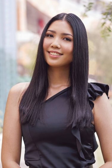 Straight hair ideas: Asian woman with long black straight hair smiling outdoors