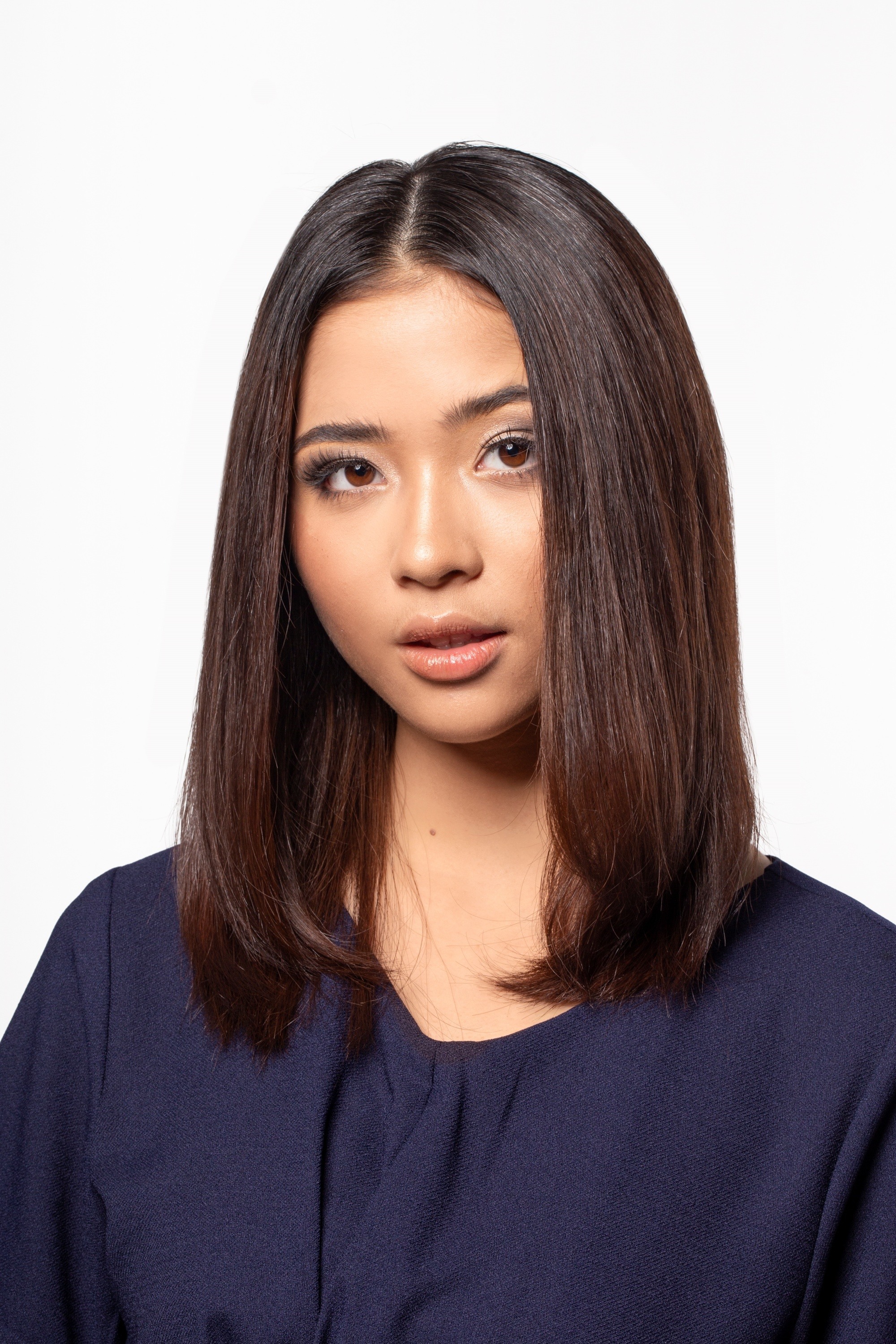 Asian woman with straight shoulder-length dark hair