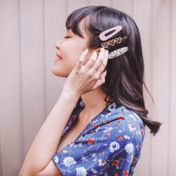 Asian woman showing how to mix and match different hair clips