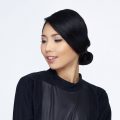 Closeup shot of an Asian woman with chignon updo hairstyle