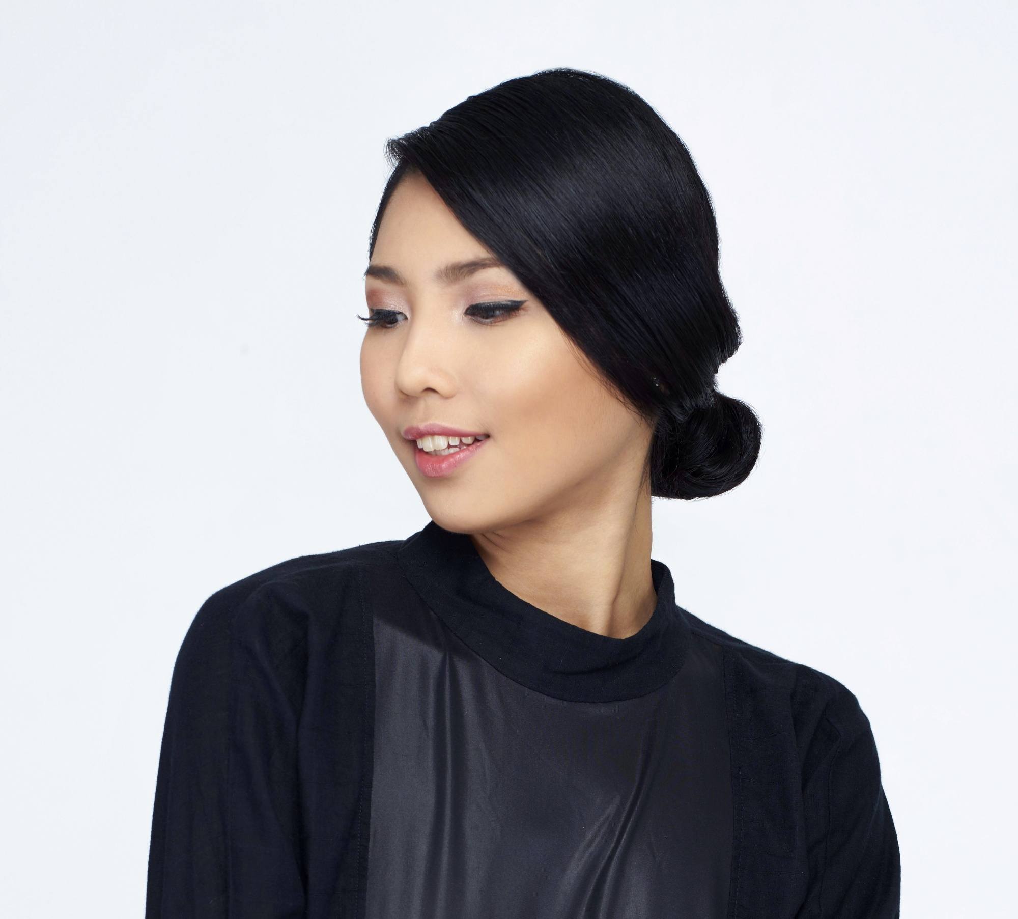 Closeup shot of an Asian woman with chignon updo hairstyle