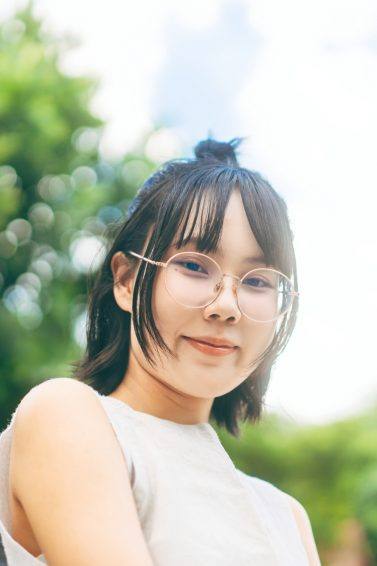 Asian woman with short hair wearing eyeglasses
