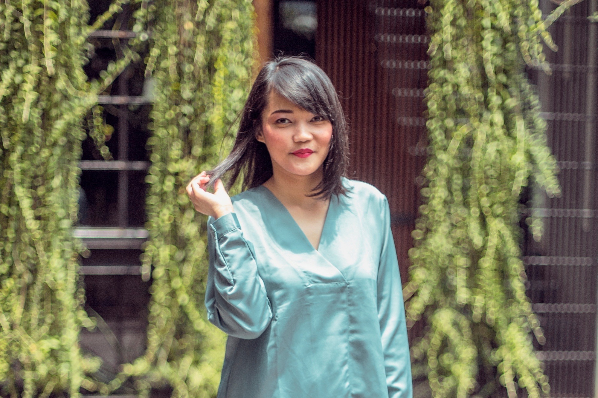 Asian woman with short hair and bangs