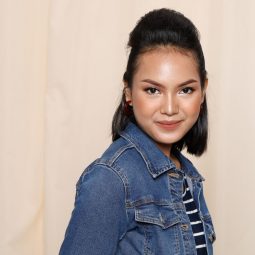 Short hairstyles for round faces: Asian woman with half updo wearing a denim jacket