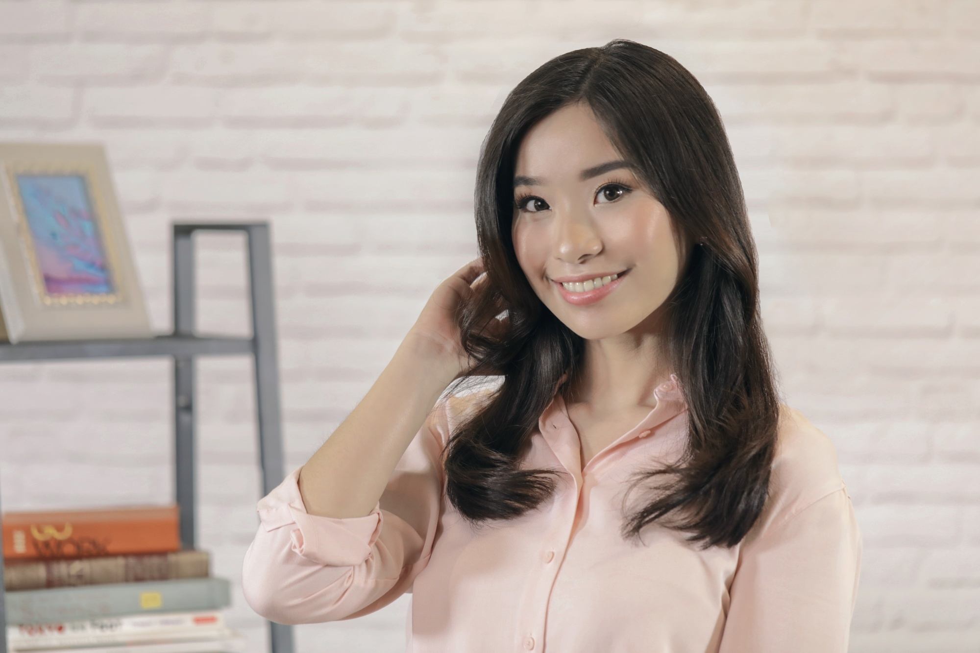 Asian woman with bouncy-looking hair