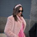 New York Fashion Week Street Style: Girl is wearing a pink dress and coat with a pink headband and sunglasses