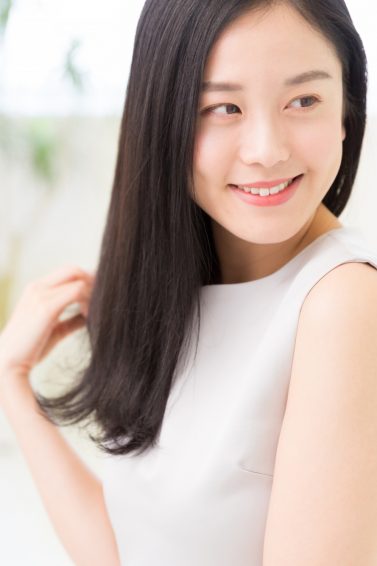 Son Hye Jin Hair Inspiration: Korean woman with long black hair wearing a white sleeveless top