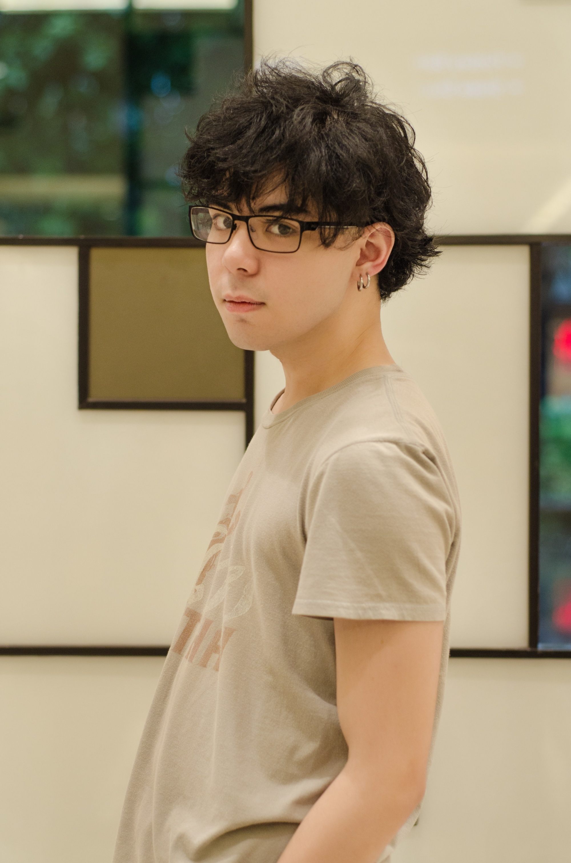 Asian man with messy medium-length hair