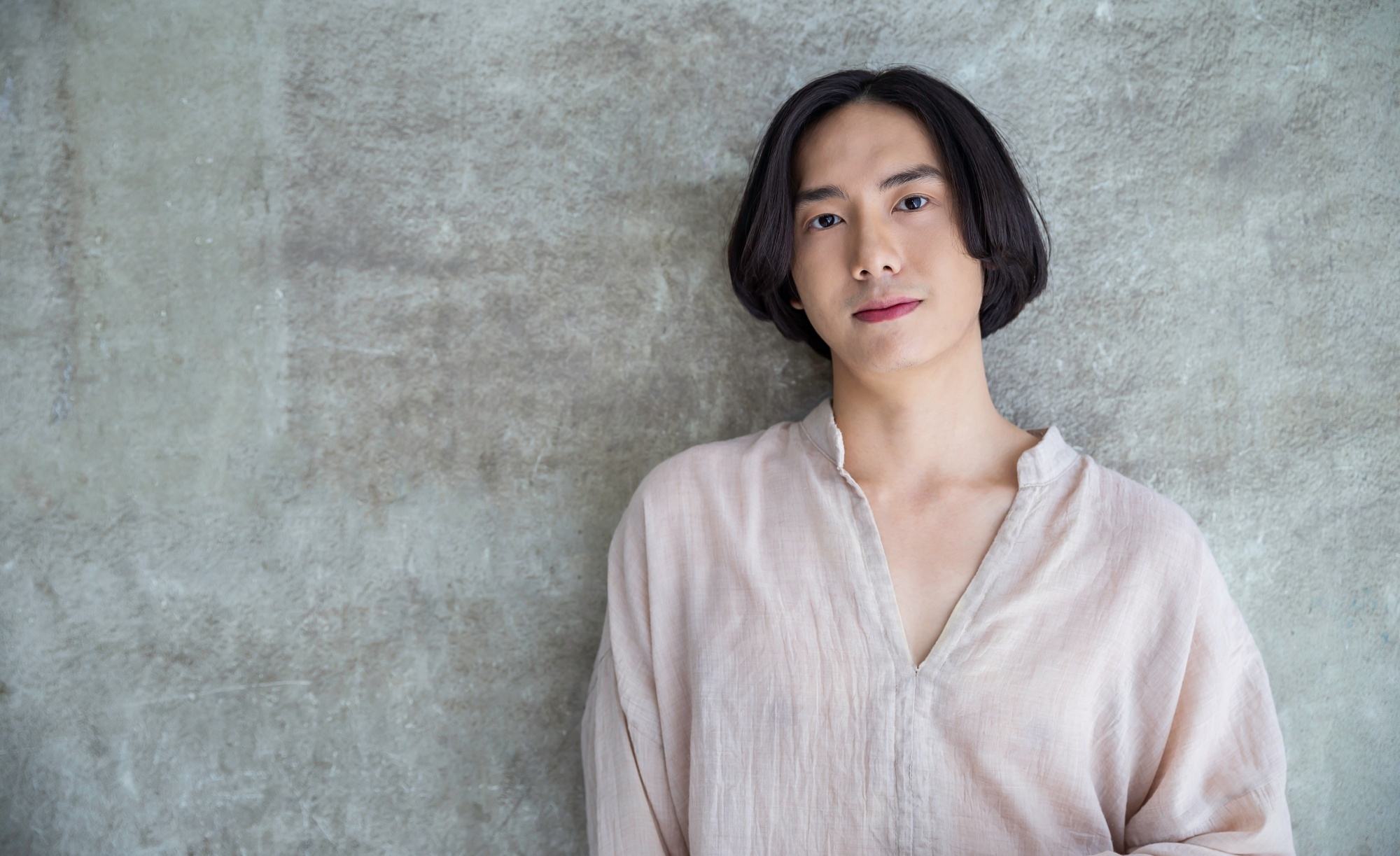 Asian man with a medium-length hairstyle