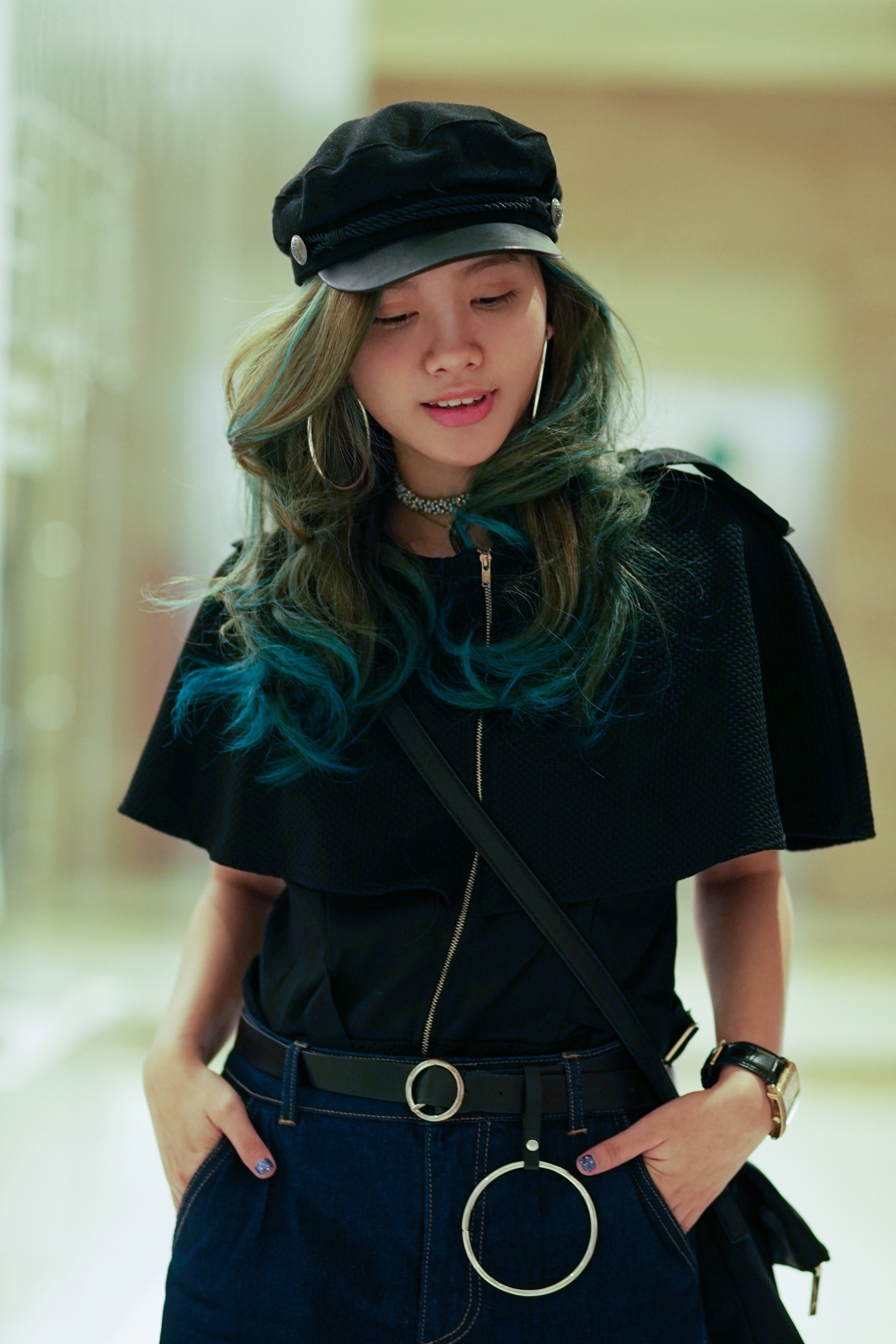 Asian woman with green and blue hair