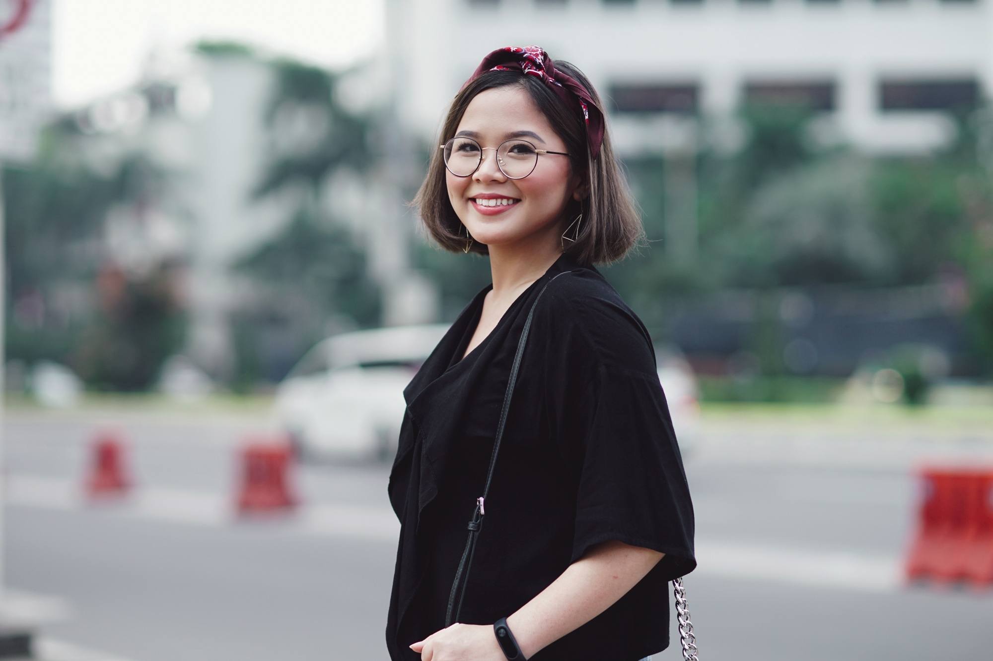 Asian woman with short hairstyle for round face smiling