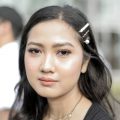 Asian woman with long hair wearing hair clips