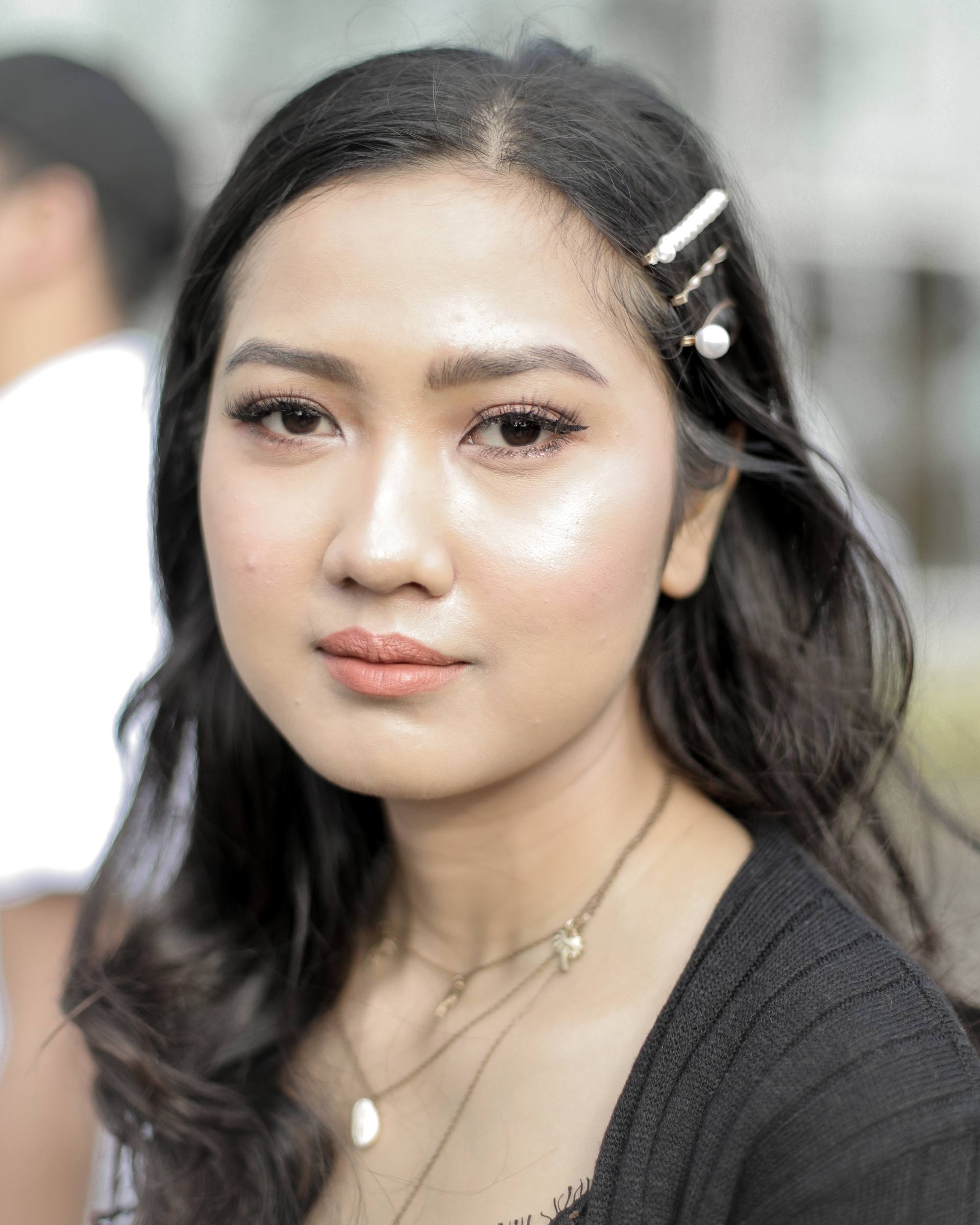 Asian woman with long hair wearing hair clips