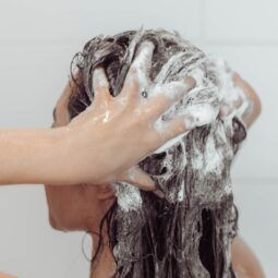Asian woman washing her thin hair